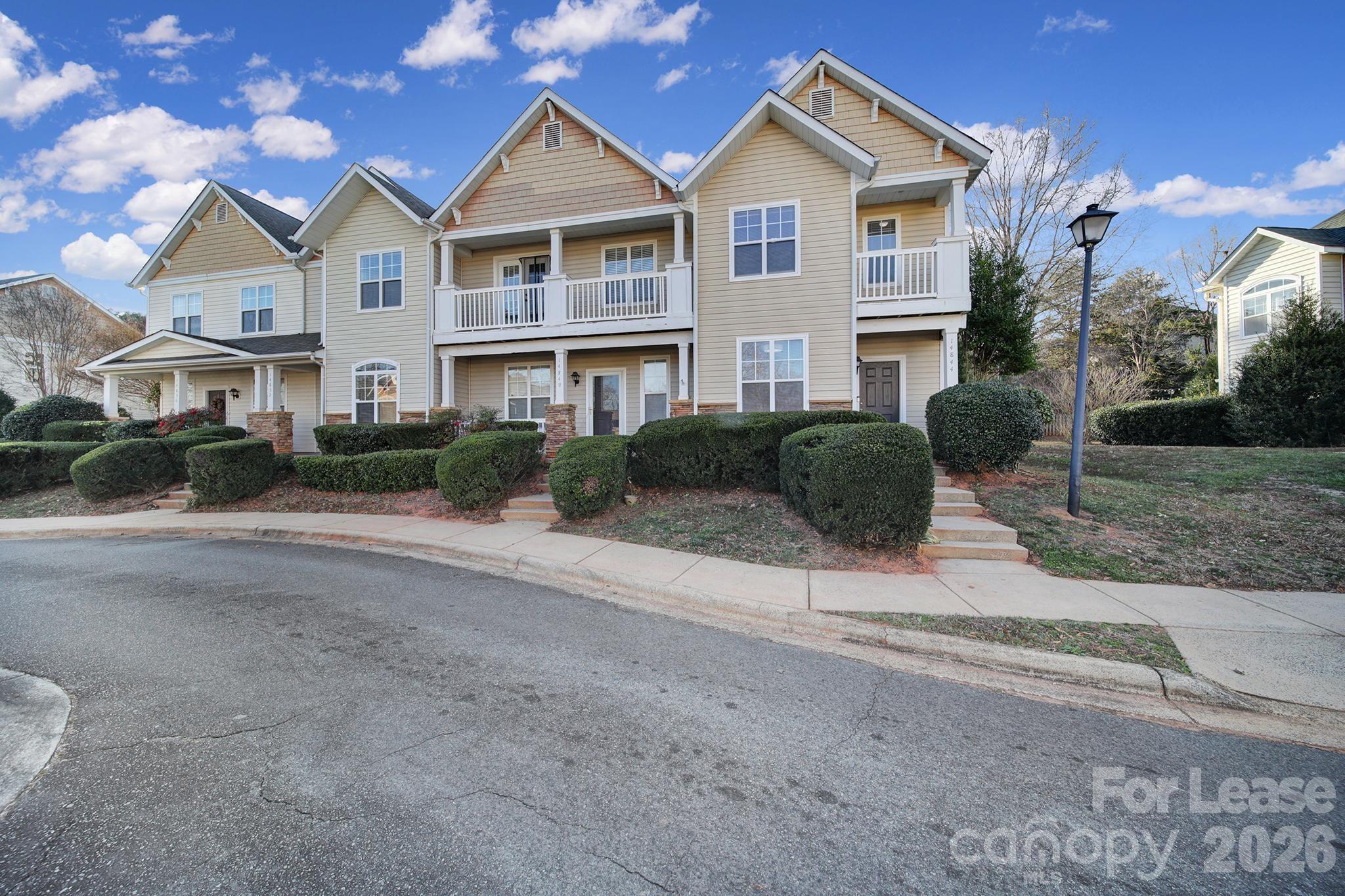 14844 Scothurst Lane Charlotte, NC 28277 - Photo 29 of 33 a front view of a house with a yard