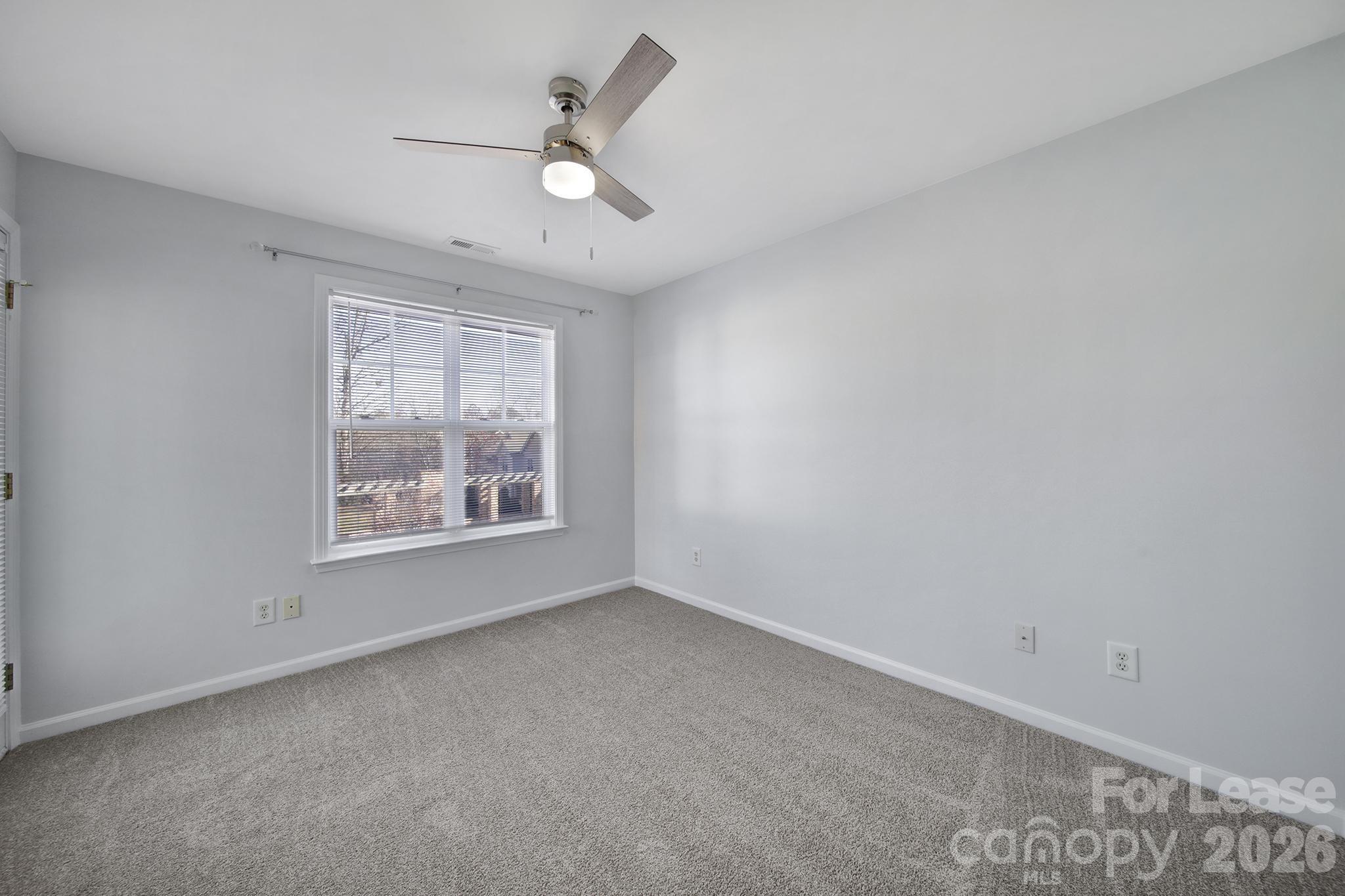 14844 Scothurst Lane Charlotte, NC 28277 - Photo 3 of 33 an empty room with a window