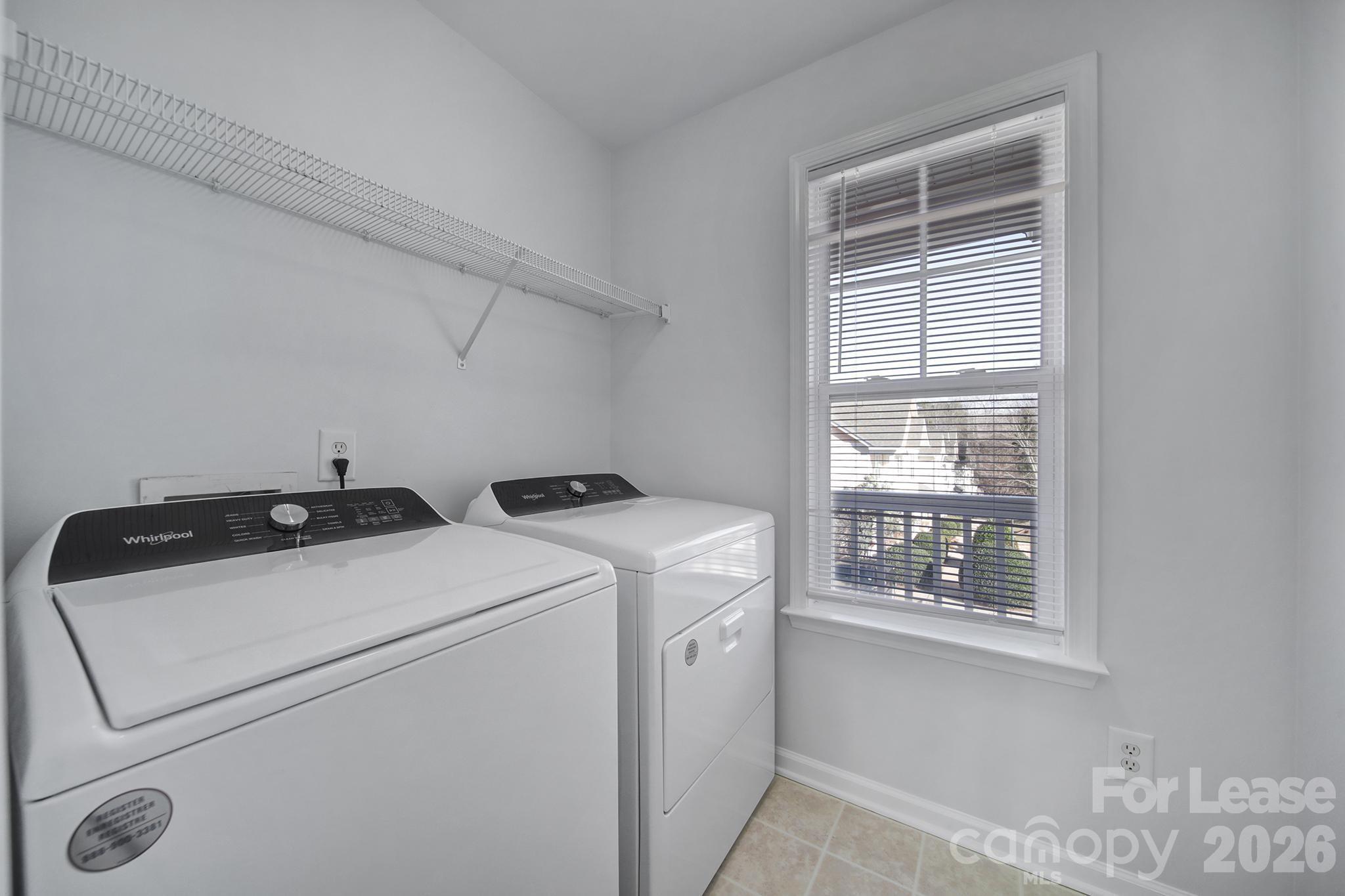14844 Scothurst Lane Charlotte, NC 28277 - Photo 6 of 33 a utility room with dryer and washer
