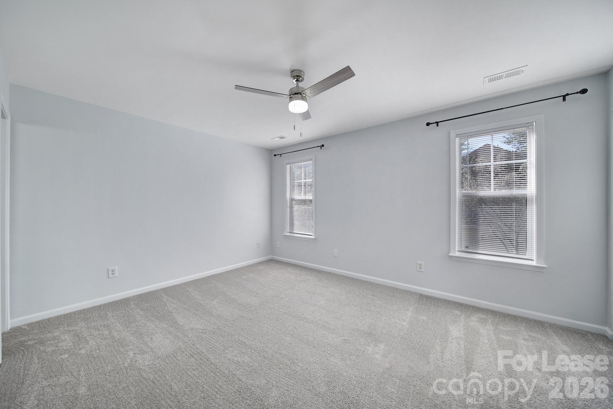 14844 Scothurst Lane Charlotte, NC 28277 - Photo 8 of 33 an empty room with windows and closet