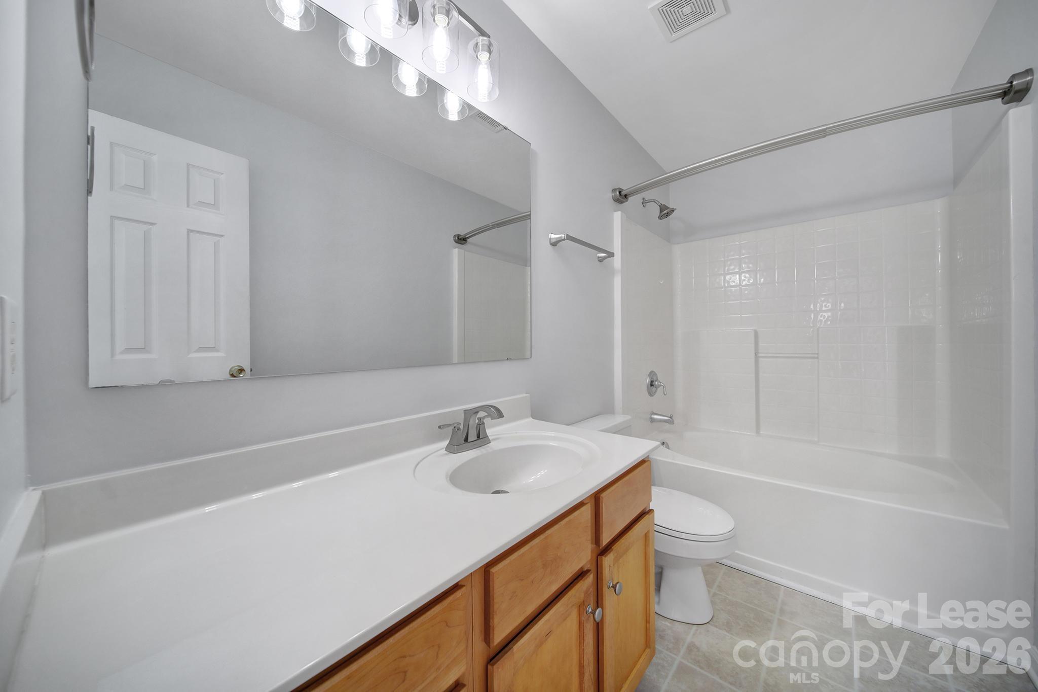 14844 Scothurst Lane Charlotte, NC 28277 - Photo 10 of 33 a bathroom with a sink a toilet and shower