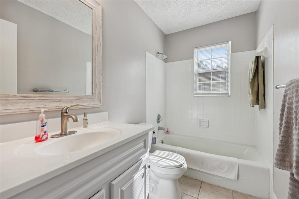 3 Silver Court Ocala, FL 34472 - Photo 14 of 25 a bathroom with a sink toilet vanity and shower