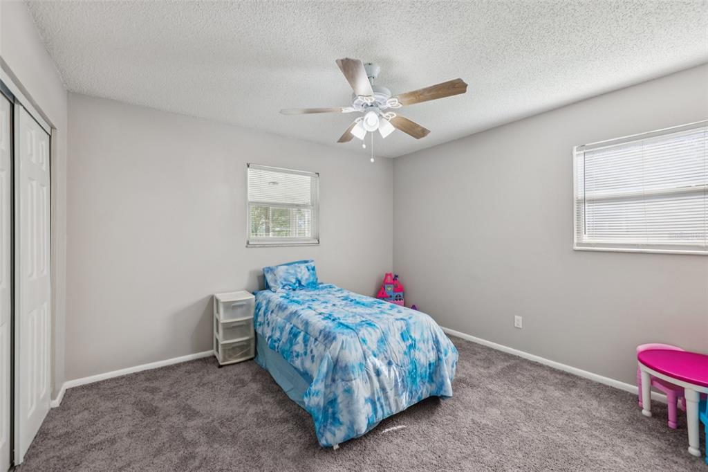 3 Silver Court Ocala, FL 34472 - Photo 15 of 25 a bedroom with a bed and a window