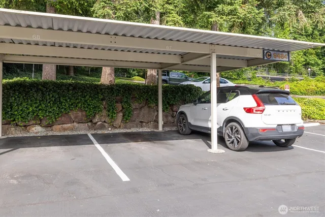 a white car parked in front of a house