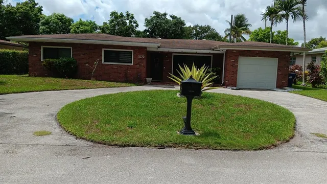 a house view with a garden space