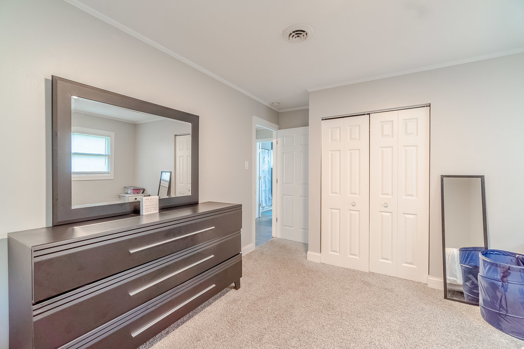 172 Monee Road Park Forest, IL 60466 - Photo 9 of 16 a room with a bed and a mirror