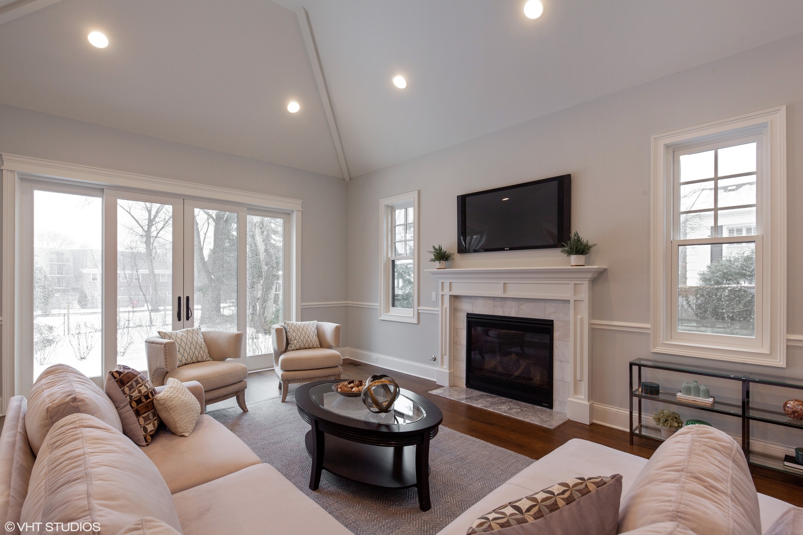 117 Church Road Winnetka, IL 60093 - Photo 13 of 29 a living room with furniture a fireplace and a flat screen tv