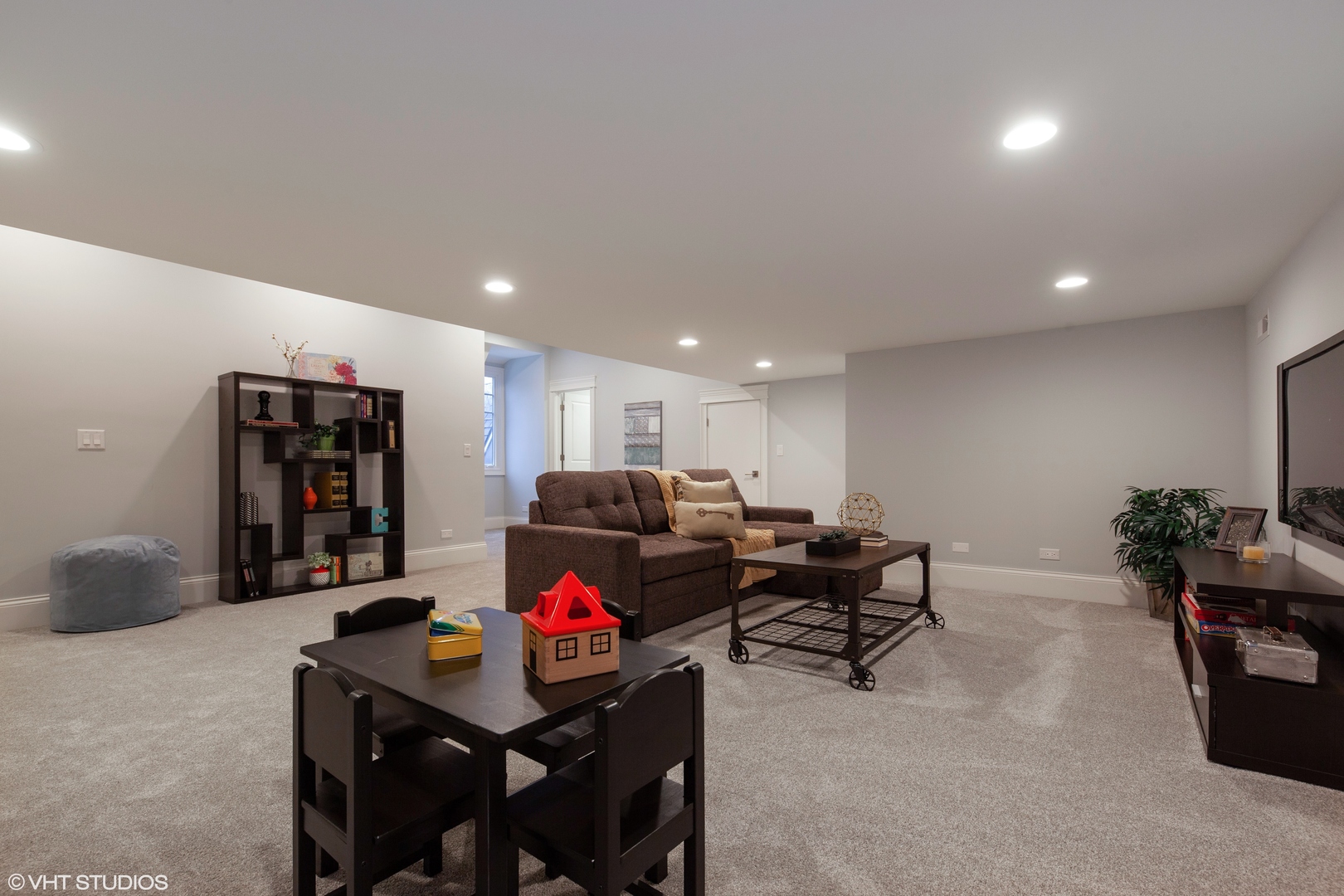 117 Church Road Winnetka, IL 60093 - Photo 17 of 29 a living room with furniture and a flat screen tv
