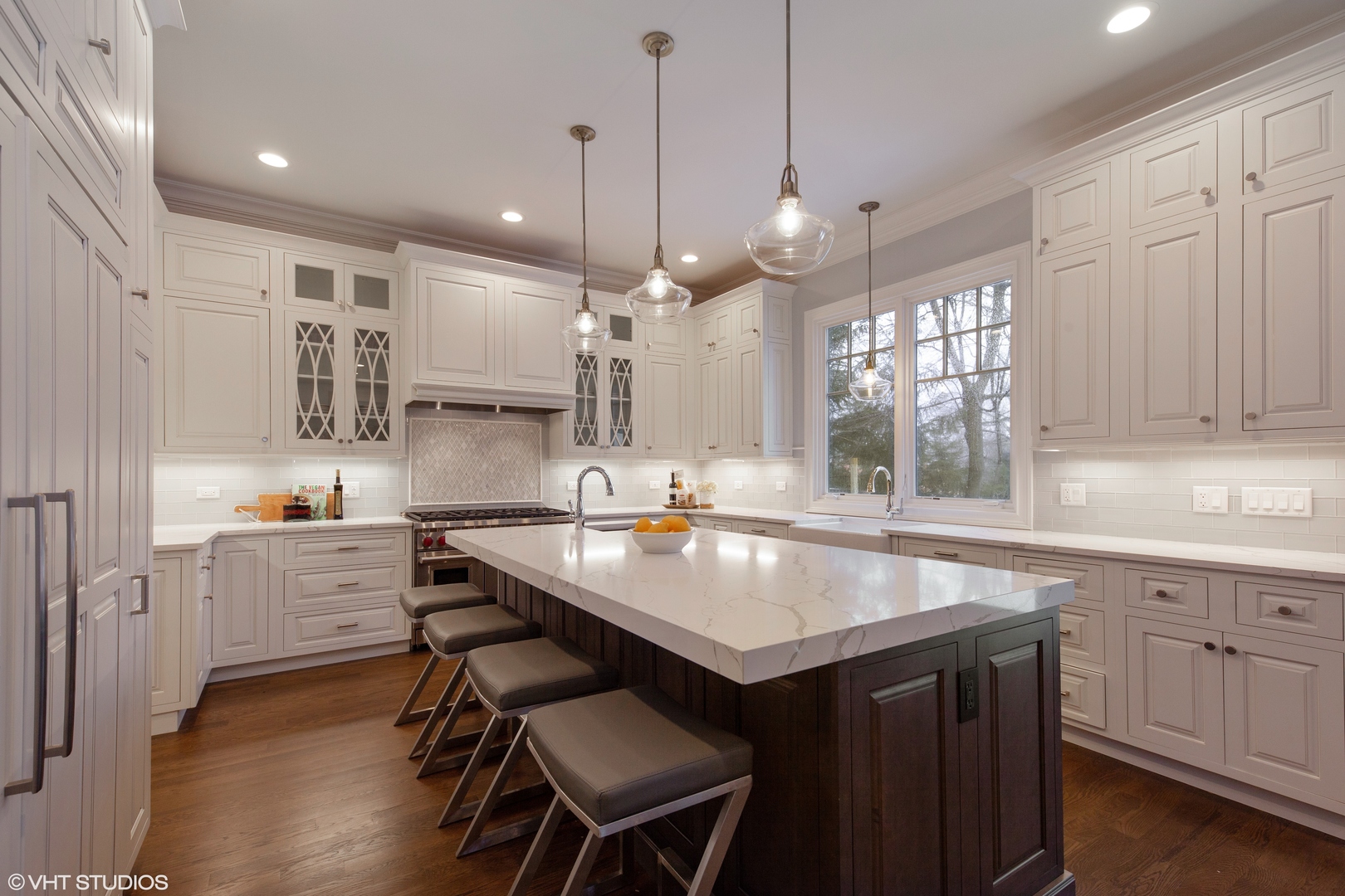 117 Church Road Winnetka, IL 60093 - Photo 7 of 29 a kitchen with sink cabinets and wooden floor