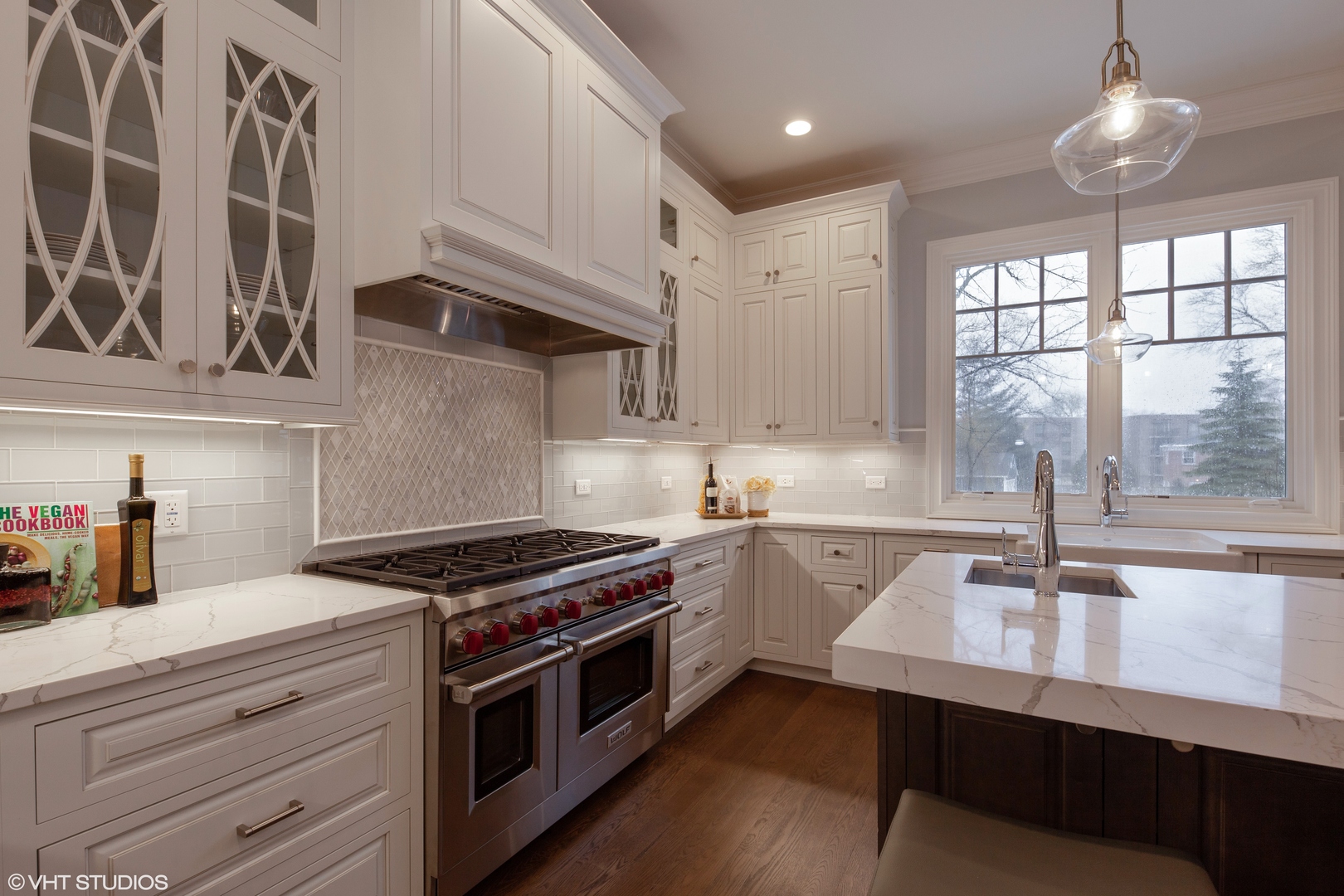 117 Church Road Winnetka, IL 60093 - Photo 9 of 29 a kitchen with stainless steel appliances a sink a stove and cabinets