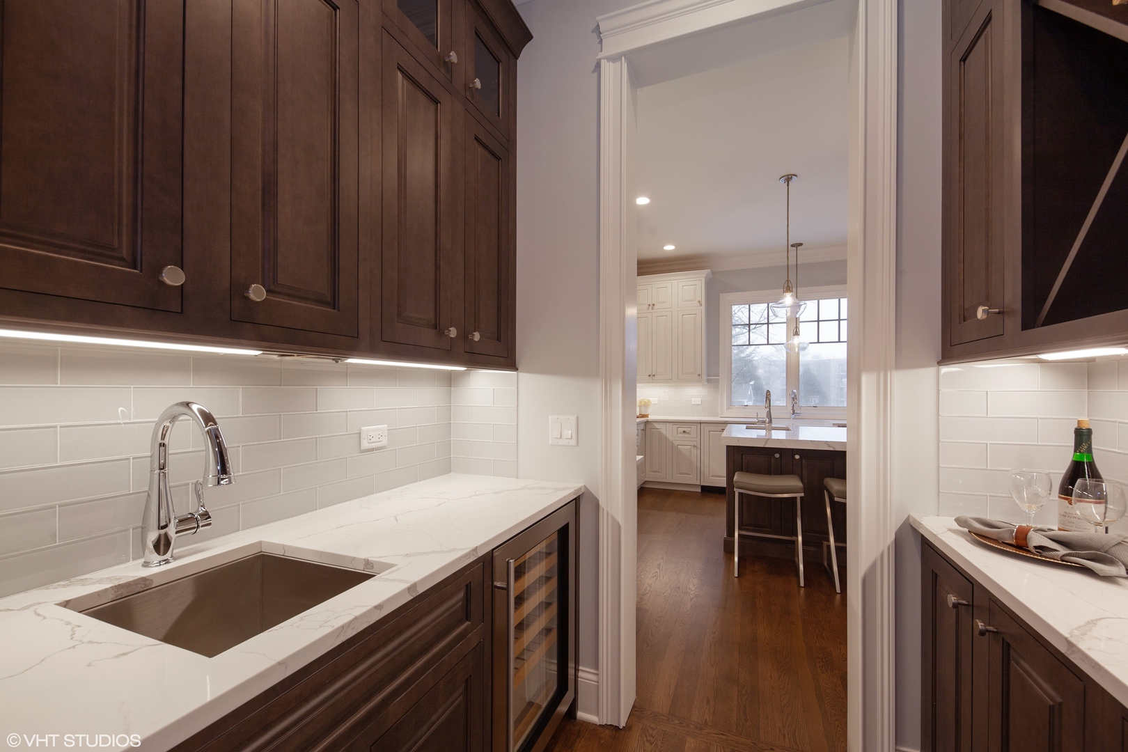 117 Church Road Winnetka, IL 60093 - Photo 10 of 29 a kitchen with a sink cabinets and wooden floor