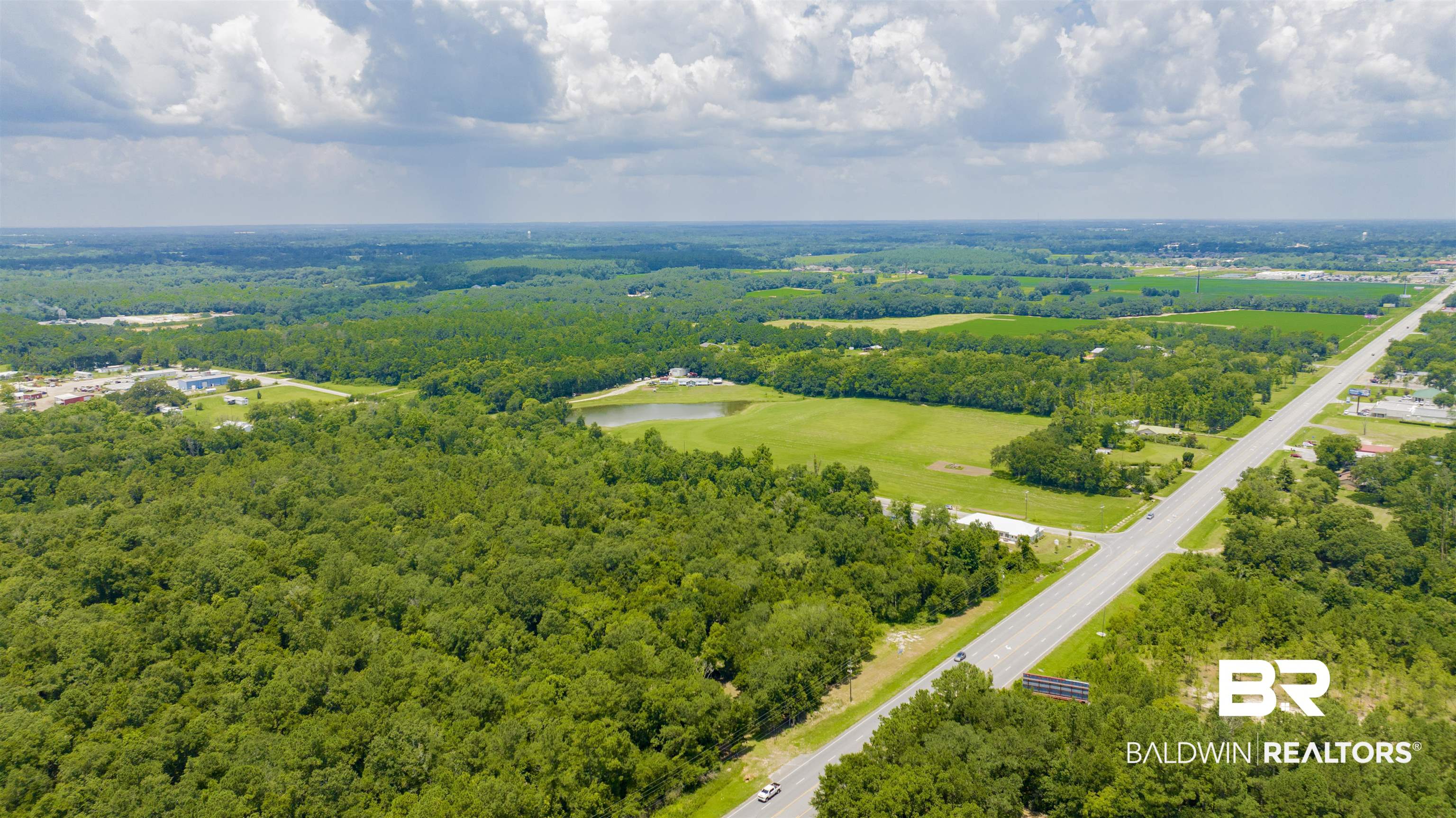 0 Vaughn Road Summerdale, AL 36580 - Photo 5 of 9 Drone / aerial view of a heavily wooded area and a nearby body of water