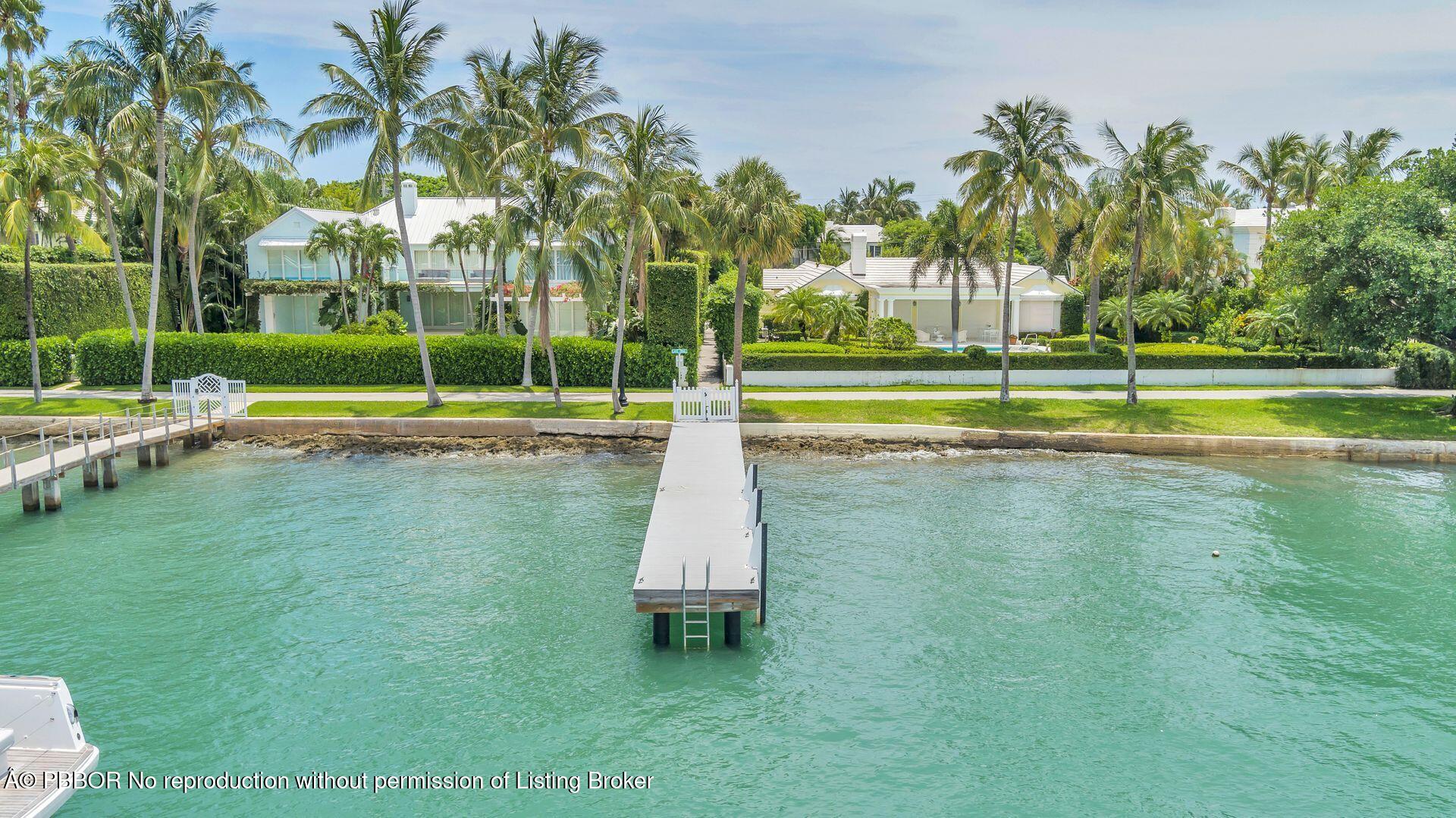 255 Colonial Lane Palm Beach, FL 33480 - Photo 31 of 32 a view of a swimming pool with a yard