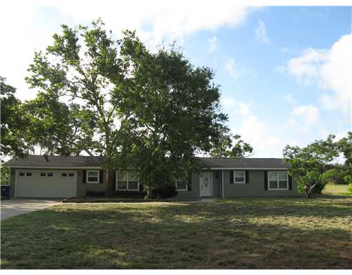 3268 Ave A Ingleside, TX 78362 - Photo 1 of 7 a front view of a house with a garden