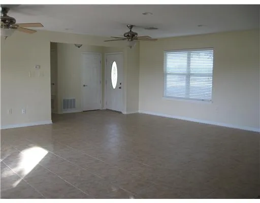 a view of a kitchen with furniture and a window