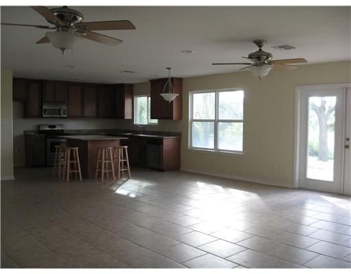 3268 Ave A Ingleside, TX 78362 - Photo 5 of 7 a view of a kitchen with furniture and a window