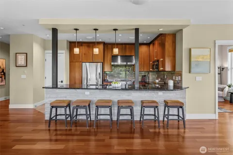 a room with lots of wooden furniture table and chairs