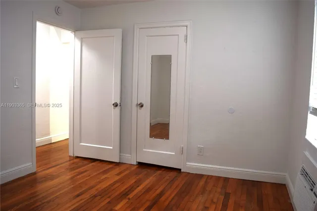 a view of road with large trees