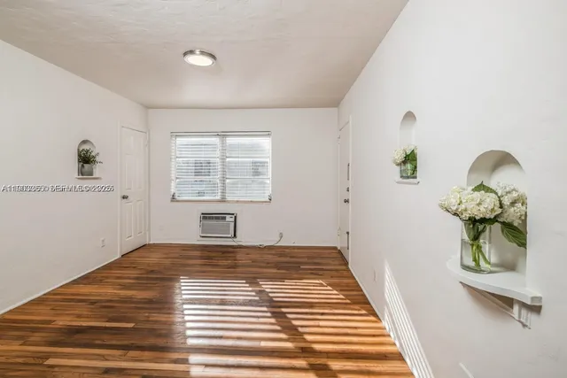 a view of a bedroom with a window