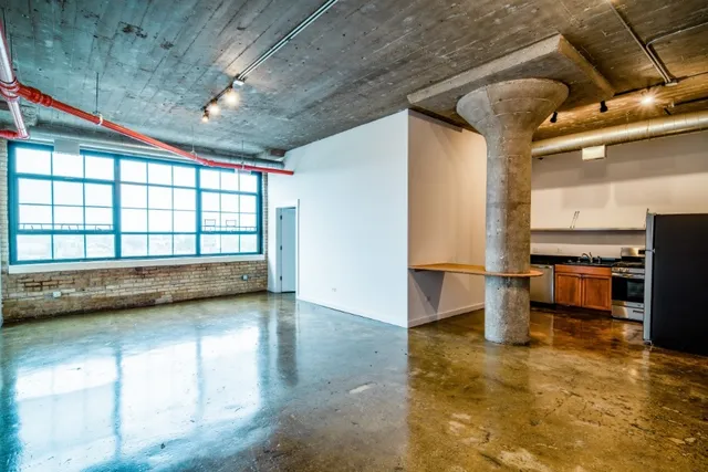 a view of empty room with ceiling fan