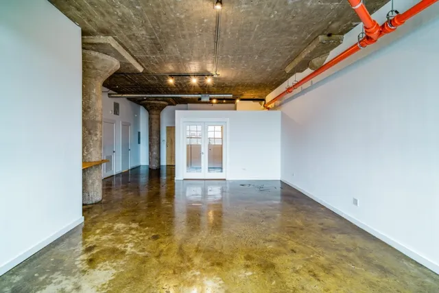 a view of walk in closet with wooden floor