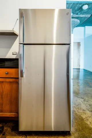 a room with a mirror and vanity