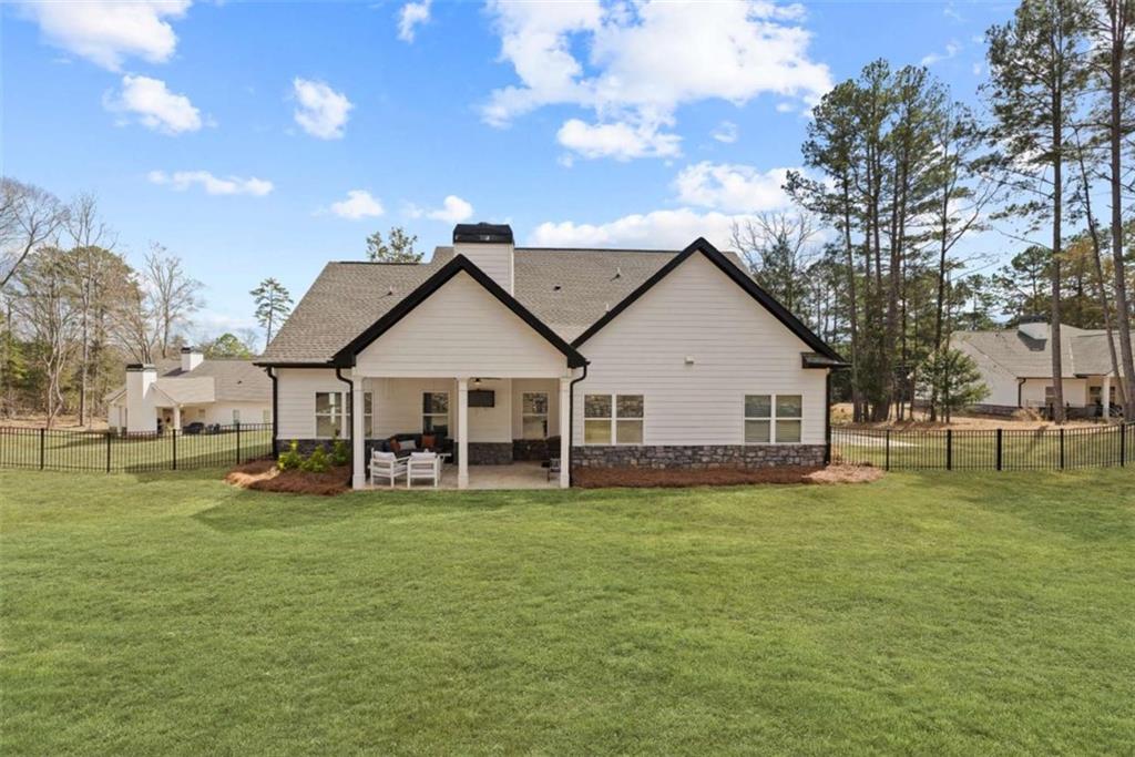 105 Capps Lane Eatonton, GA 31024 - Photo 20 of 65 a view of a house with a yard