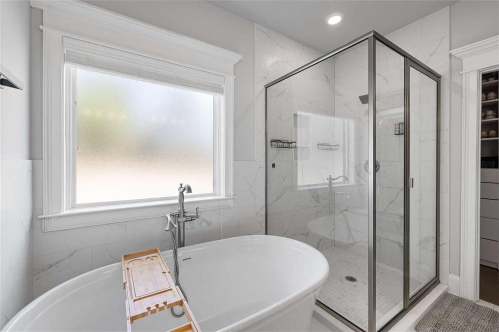 105 Capps Lane Eatonton, GA 31024 - Photo 35 of 65 a bathroom with a bathtub and a shower
