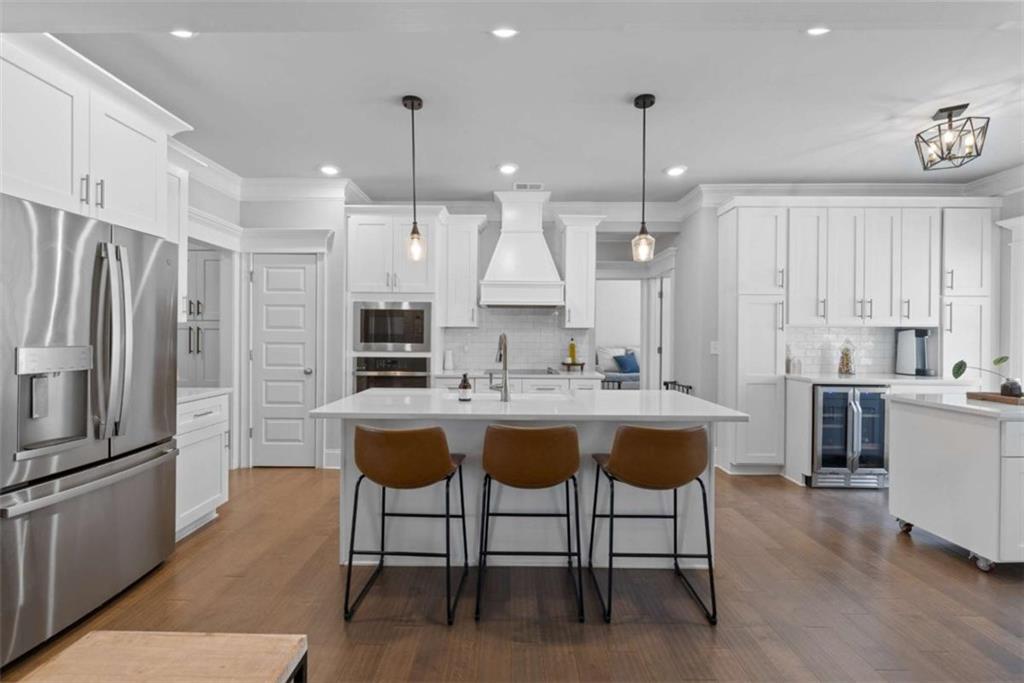 105 Capps Lane Eatonton, GA 31024 - Photo 46 of 65 a kitchen with kitchen island stainless steel appliances a sink and a center island
