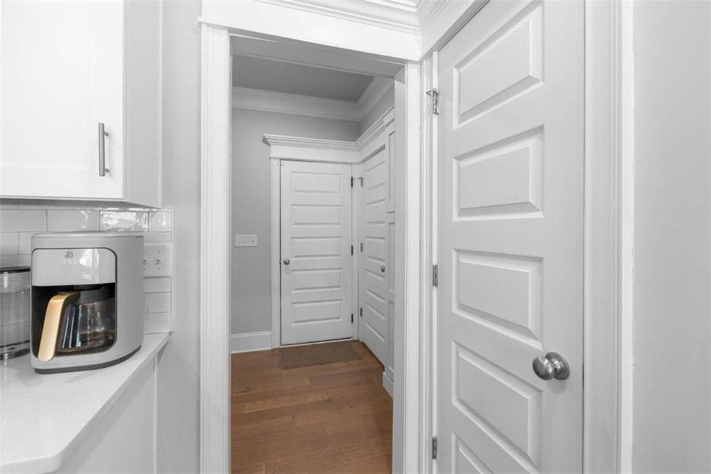 105 Capps Lane Eatonton, GA 31024 - Photo 48 of 65 a view of a hallway with wooden floor and closet