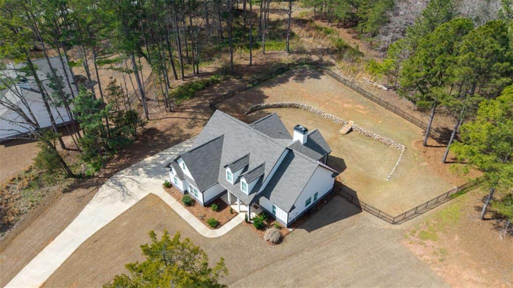105 Capps Lane Eatonton, GA 31024 - Photo 5 of 65 an aerial view of a house with a yard and lake view