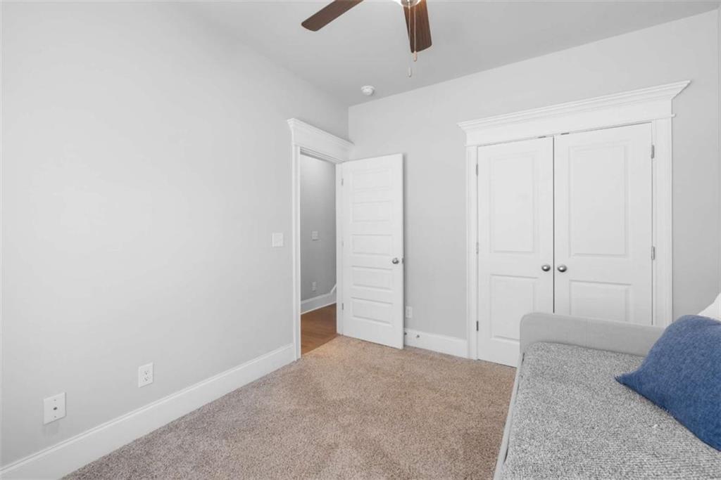 105 Capps Lane Eatonton, GA 31024 - Photo 56 of 65 an empty room with closet and a chandelier fan