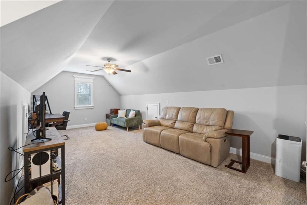 105 Capps Lane Eatonton, GA 31024 - Photo 60 of 65 a living room with furniture and a flat screen tv