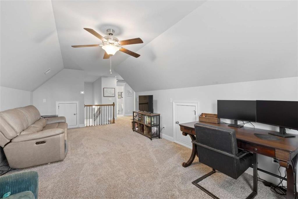 105 Capps Lane Eatonton, GA 31024 - Photo 62 of 65 a workspace with a couch and a ceiling fan