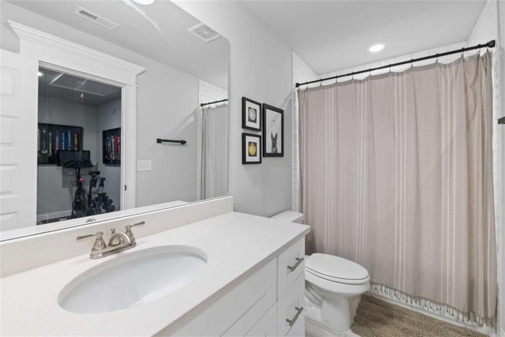 105 Capps Lane Eatonton, GA 31024 - Photo 63 of 65 a bathroom with a sink toilet and shower