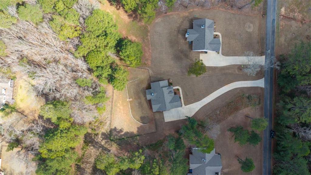 105 Capps Lane Eatonton, GA 31024 - Photo 8 of 65 an aerial view of a house with a yard