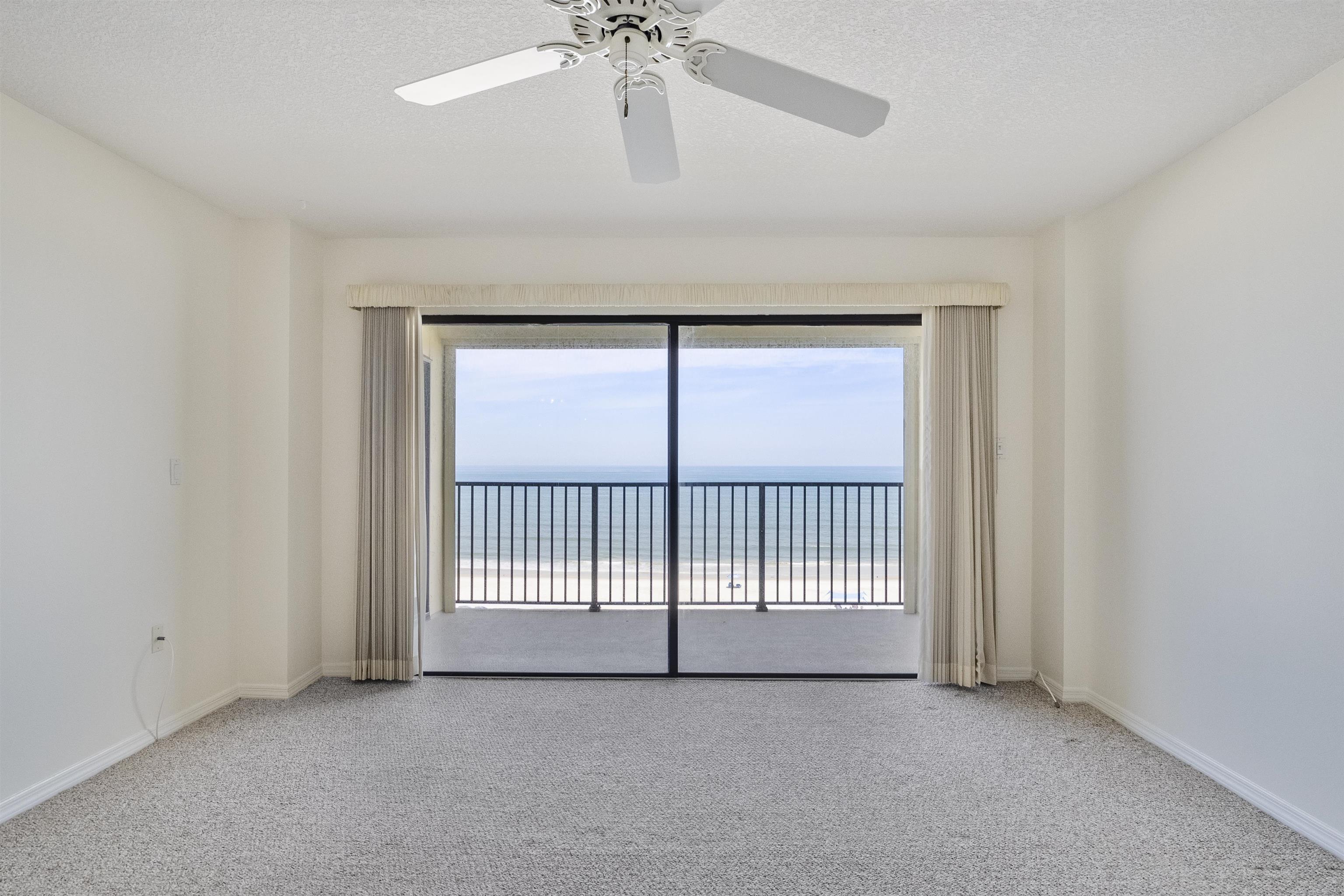8090 A1A South St. Augustine, FL 32080 - Photo 18 of 42 an empty room with chandelier fan