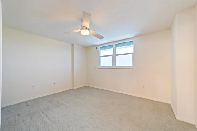 a view of room with closet and racks