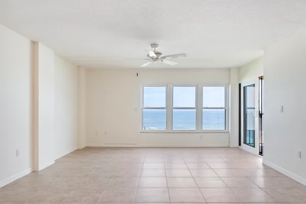 a view of a balcony with a floor to ceiling window