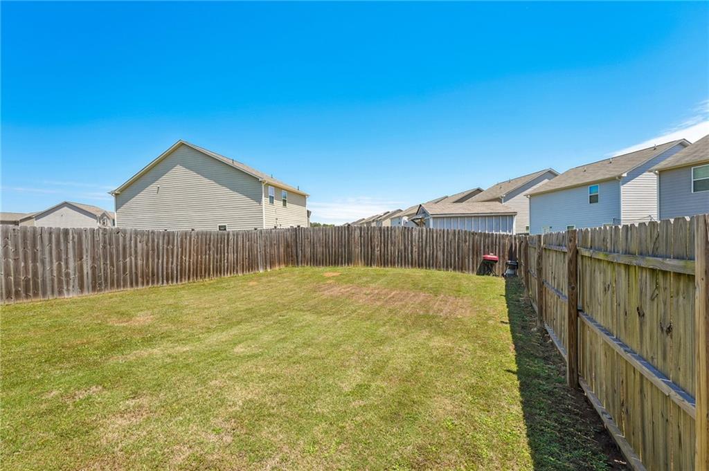 10933 Wheeler Trace Hampton, GA 30228 - Photo 17 of 22 a view of a backyard