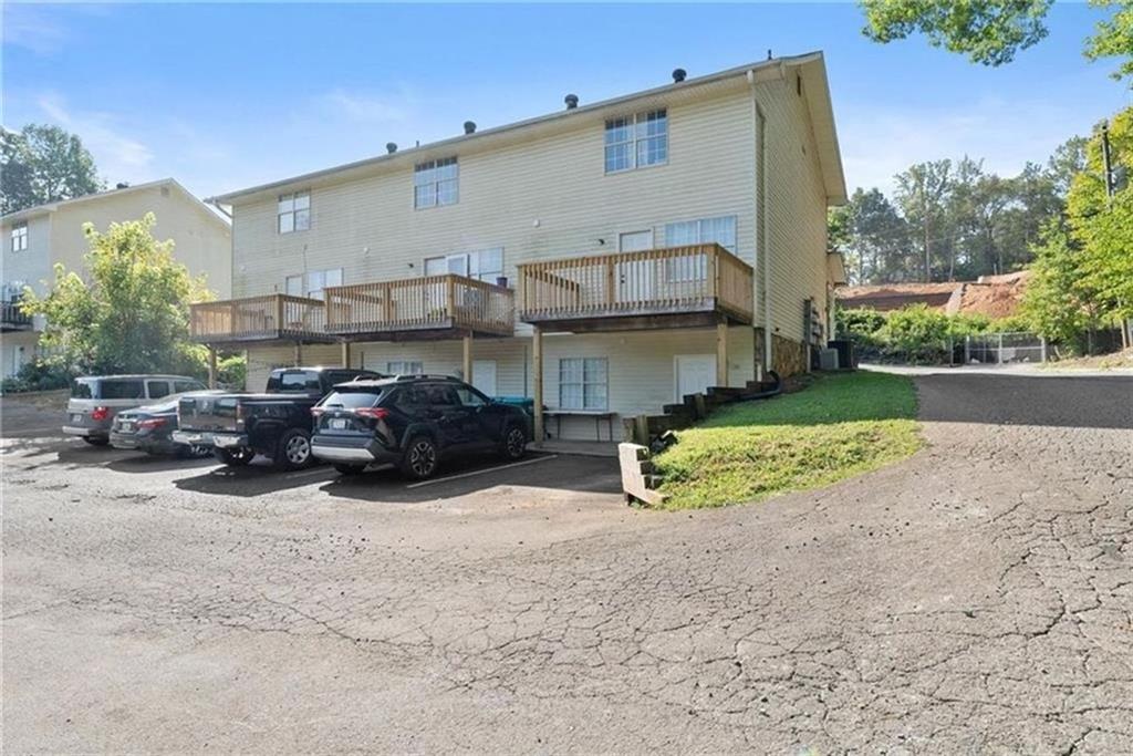 330 Herndon Way, Unit 116 Canton, GA 30114 - Photo 1 of 1 a view of a car park in front of house