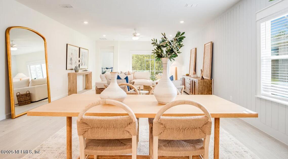 20 Neighbor Court St. Augustine, FL 32092 - Photo 69 of 71 a living room with dining table and a large window