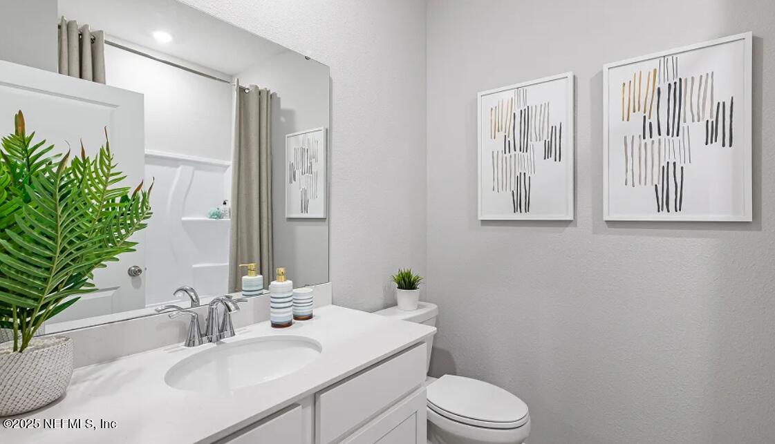 20 Neighbor Court St. Augustine, FL 32092 - Photo 71 of 71 a bathroom with a sink toilet and vanity