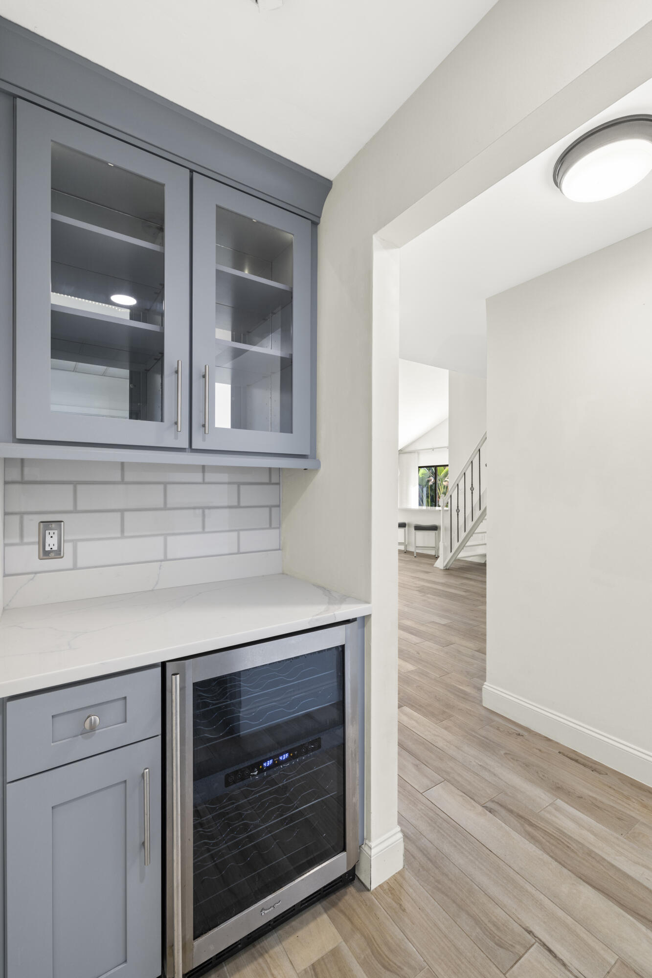 125 Cape Pointe Circle Jupiter, FL 33477 - Photo 10 of 45 a kitchen with a wooden floor and a fireplace