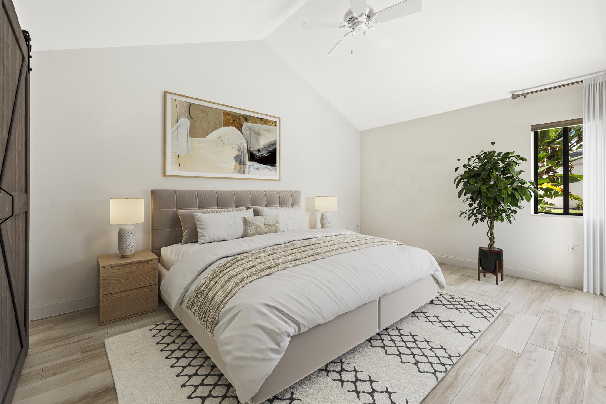 125 Cape Pointe Circle Jupiter, FL 33477 - Photo 11 of 45 a bedroom with a large bed and a potted plant