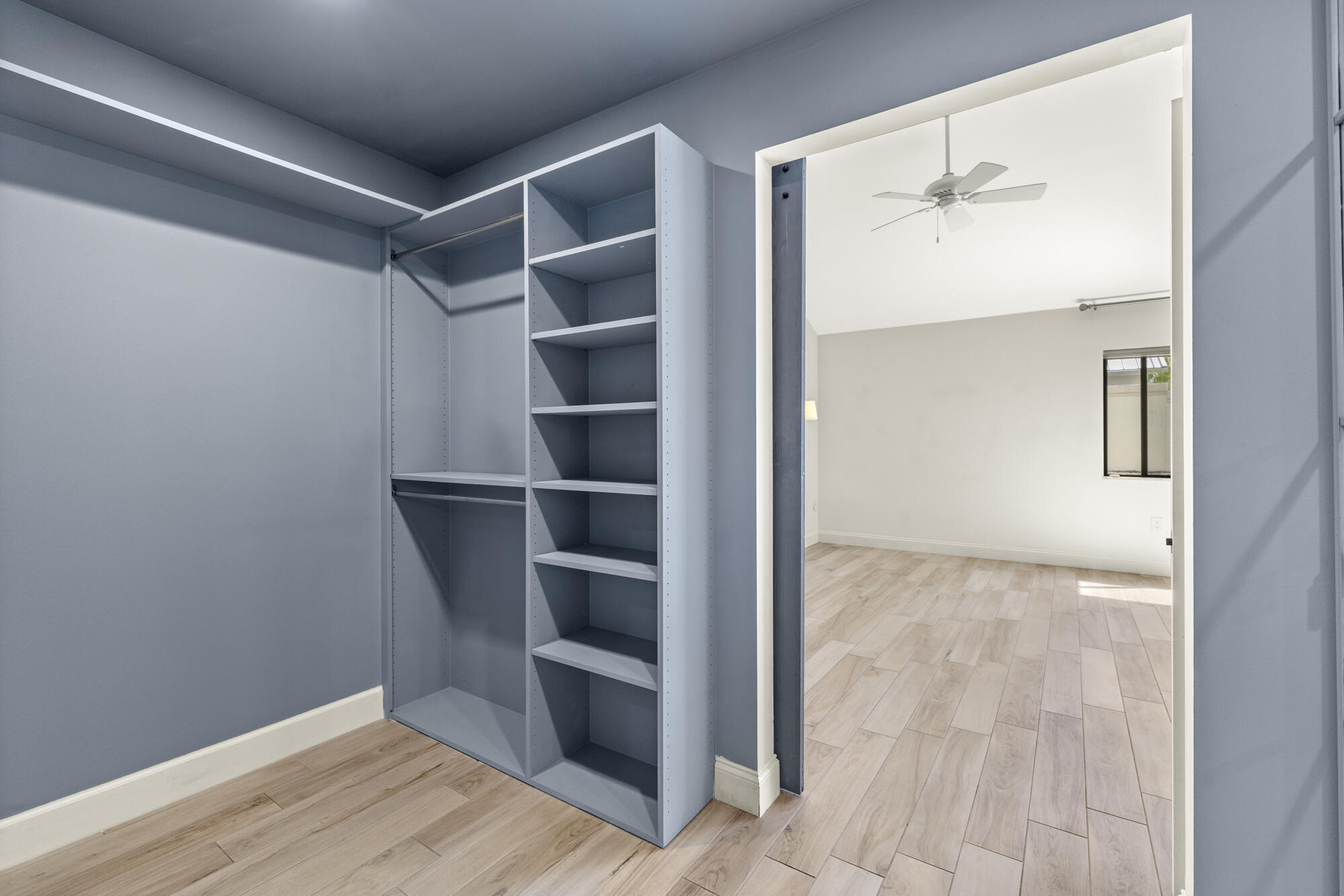 125 Cape Pointe Circle Jupiter, FL 33477 - Photo 14 of 45 a view of walk in closet with empty racks