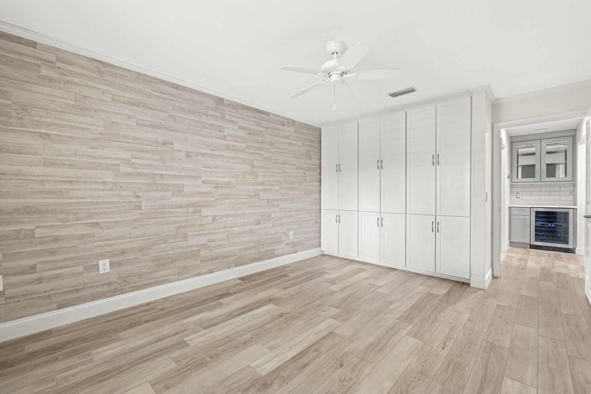 125 Cape Pointe Circle Jupiter, FL 33477 - Photo 18 of 45 a view of an empty room with wooden floor