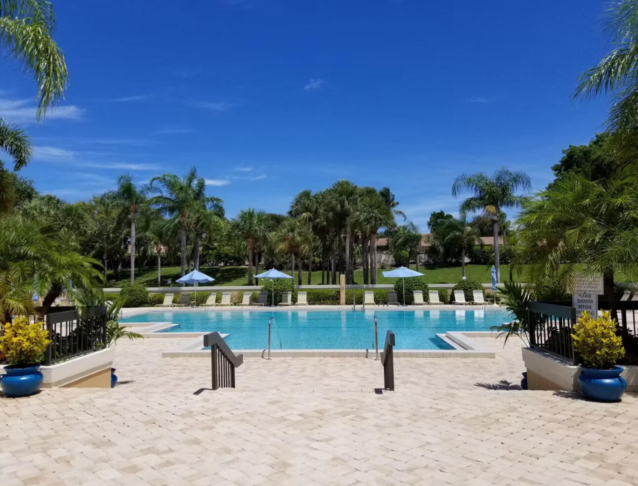125 Cape Pointe Circle Jupiter, FL 33477 - Photo 32 of 45 a view of a swimming pool with a patio