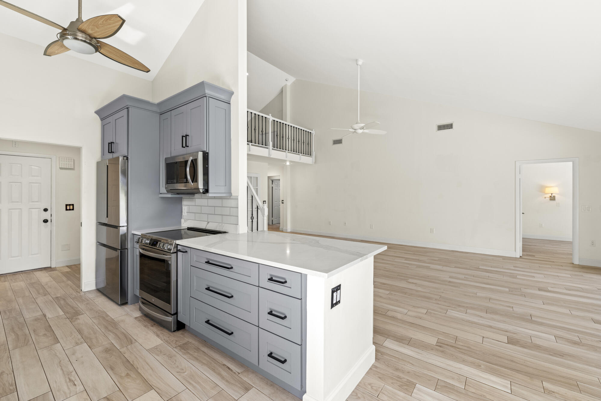 125 Cape Pointe Circle Jupiter, FL 33477 - Photo 7 of 45 a kitchen with stainless steel appliances granite countertop a stove and a sink