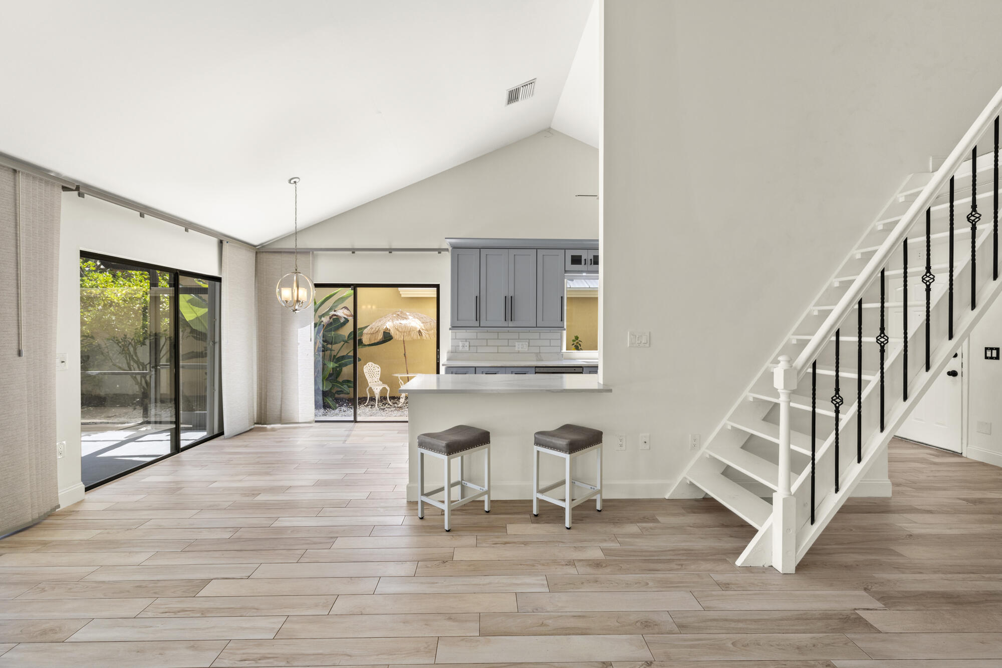 125 Cape Pointe Circle Jupiter, FL 33477 - Photo 9 of 45 a view of entryway and hall with wooden floor